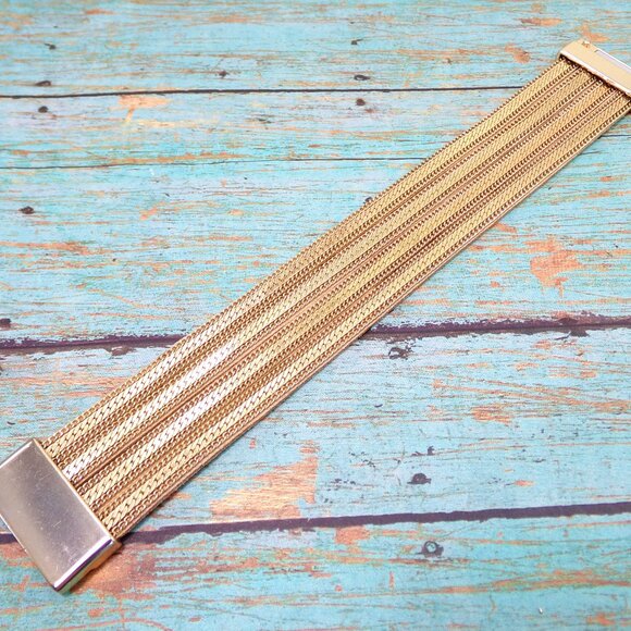 Wide gold chain bracelet with four rows of chain backed with a soft suede. - Picture 2 of 12